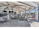 Outdoor restaurant area with bar, high ceilings, ceiling fans, table seating, and a breezy atmosphere at 14049 Black Beauty Dr # 721, Punta Gorda, FL 33955