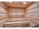 A relaxing cedar sauna with wooden benches and an adjustable temperature control system at 14049 Black Beauty Dr # 721, Punta Gorda, FL 33955