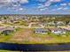 A beautiful single-Gathering blue home situated on a waterfront canal with lush landscaping and expansive neighborhood views at 149 Sportsman Rd, Rotonda West, FL 33947