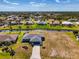 A beautiful single-Gathering blue home situated on a waterfront canal with lush landscaping and expansive neighborhood views at 149 Sportsman Rd, Rotonda West, FL 33947