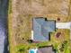 Overhead shot of the beautiful gray roof of a home next to a canal and manicured landscaping at 149 Sportsman Rd, Rotonda West, FL 33947