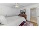 Comfortable bedroom featuring a ceiling fan, dresser, wood floors, and neutral decor at 149 Sportsman Rd, Rotonda West, FL 33947