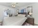 Bright bedroom with hardwood floors, and a connecting room with view of exterior at 149 Sportsman Rd, Rotonda West, FL 33947