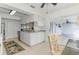 Bright kitchen featuring white cabinetry, stainless steel appliances, and sliding doors to the lanai at 149 Sportsman Rd, Rotonda West, FL 33947