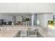 Kitchen features granite countertops, stainless dishwasher, and easy access to living and dining areas at 149 Sportsman Rd, Rotonda West, FL 33947