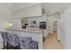 Kitchen bar with seating overlooking modern appliances and granite countertops; great flow and entertaining space at 149 Sportsman Rd, Rotonda West, FL 33947