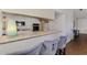 Kitchen bar with seating overlooking modern appliances and granite countertops; great flow and entertaining space at 149 Sportsman Rd, Rotonda West, FL 33947