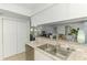 Kitchen features granite countertops, stainless dishwasher, and easy access to living and dining areas at 149 Sportsman Rd, Rotonda West, FL 33947