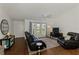 This bright living room is open and airy, with hardwood floors, and modern furnishings at 149 Sportsman Rd, Rotonda West, FL 33947