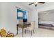 Comfortable office space featuring a desk and chair, with view of the bedroom at 149 Sportsman Rd, Rotonda West, FL 33947