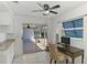 Bright office space featuring a ceiling fan, natural light, and view of the lanai at 149 Sportsman Rd, Rotonda West, FL 33947