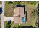 Overhead view of a single-Gathering home with a screened-in pool and well-maintained landscaping at 156 Danforth Dr, Punta Gorda, FL 33980