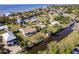 Stunning aerial view of waterfront property with a pool and beautiful canal at 156 Danforth Dr, Punta Gorda, FL 33980