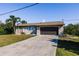A beautiful home featuring a spacious driveway and well-manicured lawn at 156 Danforth Dr, Punta Gorda, FL 33980