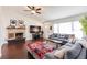 Cozy living room features a brick fireplace, hardwood floors, and comfortable seating at 156 Danforth Dr, Punta Gorda, FL 33980