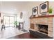 Inviting living room features a fireplace, bright white walls, and sliding glass doors to the patio at 156 Danforth Dr, Punta Gorda, FL 33980