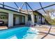 Screened pool area showcasing an inviting pool, spacious patio, and seamless indoor-outdoor flow at 156 Danforth Dr, Punta Gorda, FL 33980