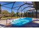 Inviting pool surrounded by stone pavers and a screened enclosure allowing for open views of the landscaped yard at 156 Danforth Dr, Punta Gorda, FL 33980