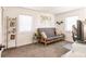 Relaxing room featuring neutral tones, a day bed, a desk, and natural light at 156 Danforth Dr, Punta Gorda, FL 33980