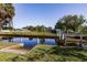 Property with canal access and concrete ramp, beautiful landscaping at 156 Danforth Dr, Punta Gorda, FL 33980