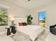 Bright bedroom with modern accents, large windows offering scenic views, and cozy furnishings at 16210 Cape Horn Blvd, Punta Gorda, FL 33955