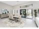 Dining area with modern table and chairs next to sliding glass doors and view of the outdoors at 16210 Cape Horn Blvd, Punta Gorda, FL 33955