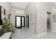 Grand entryway with high ceilings, light tile floors, and modern design elements at 16210 Cape Horn Blvd, Punta Gorda, FL 33955