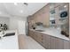 Modern kitchen with stainless steel appliances, quartz countertops, and sleek cabinetry, perfect for cooking at 16210 Cape Horn Blvd, Punta Gorda, FL 33955