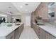 Modern kitchen with stainless steel appliances, quartz countertops, and sleek cabinetry, perfect for cooking at 16210 Cape Horn Blvd, Punta Gorda, FL 33955