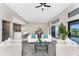 Modern living room featuring a white couch with blue pillows, sleek furniture, and open concept design at 16210 Cape Horn Blvd, Punta Gorda, FL 33955