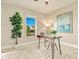 Bright office with a glass desk, stylish decor, and large potted plant at 16210 Cape Horn Blvd, Punta Gorda, FL 33955