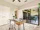 Bright and airy office space with glass desk and sliders to the screened lanai at 16210 Cape Horn Blvd, Punta Gorda, FL 33955
