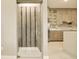 Custom wine room with glass enclosure and wood slats, next to the modern kitchen at 16210 Cape Horn Blvd, Punta Gorda, FL 33955