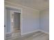 The light-filled room features neutral walls, light-colored wood floors, and decorative trim at 165 Cummins Ne Ave, Port Charlotte, FL 33952