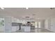 Updated kitchen with stainless steel appliances, a peninsula, and new cabinets at 165 Cummins Ne Ave, Port Charlotte, FL 33952