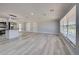 Bright living room with neutral walls, recessed lighting, and an open-concept design at 165 Cummins Ne Ave, Port Charlotte, FL 33952