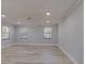 Spacious living room featuring lots of light, recessed lighting, modern light-grey flooring at 165 Cummins Ne Ave, Port Charlotte, FL 33952