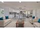 Open-concept living space featuring a modern kitchen, dining area, and comfortable seating at 165 Cummins Ne Ave, Port Charlotte, FL 33952