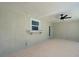Covered patio featuring stucco walls, ceiling fan, tile floor and convenient window bar at 165 Cummins Ne Ave, Port Charlotte, FL 33952