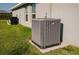 Home exterior features an updated AC Unit on a concrete pad at 17 White Marsh Ln, Rotonda West, FL 33947