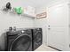 Modern laundry room featuring a Samsung washer and dryer with tile flooring at 17 White Marsh Ln, Rotonda West, FL 33947