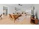 Bright living room featuring hardwood floors, neutral walls, contemporary furniture, and lots of natural light at 17 White Marsh Ln, Rotonda West, FL 33947