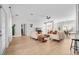 Airy and inviting living area with hardwood floors, neutral walls, modern furniture, and bright natural light at 17 White Marsh Ln, Rotonda West, FL 33947