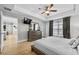 Spacious main bedroom with tray ceiling, wood floors, decorative touches and ensuite access at 17 White Marsh Ln, Rotonda West, FL 33947