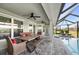 Spacious screened-in patio with dining table, outdoor seating and pool views at 17 White Marsh Ln, Rotonda West, FL 33947