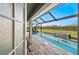 Private pool with a screened lanai, waterfall feature, and ample seating to enjoy the outdoors at 17 White Marsh Ln, Rotonda West, FL 33947
