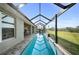 Relaxing pool area with a screened-in enclosure, and a spacious patio area at 17 White Marsh Ln, Rotonda West, FL 33947