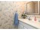 Cozy bathroom featuring a vanity with soft decor and a well-lit mirror at 22375 Edgewater Dr # 149, Punta Gorda, FL 33980
