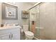 Modern bathroom featuring a glass-enclosed shower, vanity, and contemporary fixtures at 22375 Edgewater Dr # 149, Punta Gorda, FL 33980