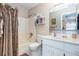 Well-maintained bathroom features a shower-tub combination and storage space at 22375 Edgewater Dr # 149, Punta Gorda, FL 33980